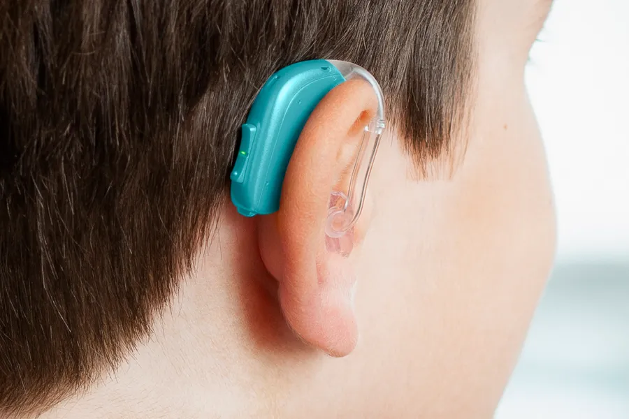 Opn_Play_BTE_PP_C058Aquamarine_AngleB45_Close-up_In-On-Ear_Boy_1200x800px_Original-file